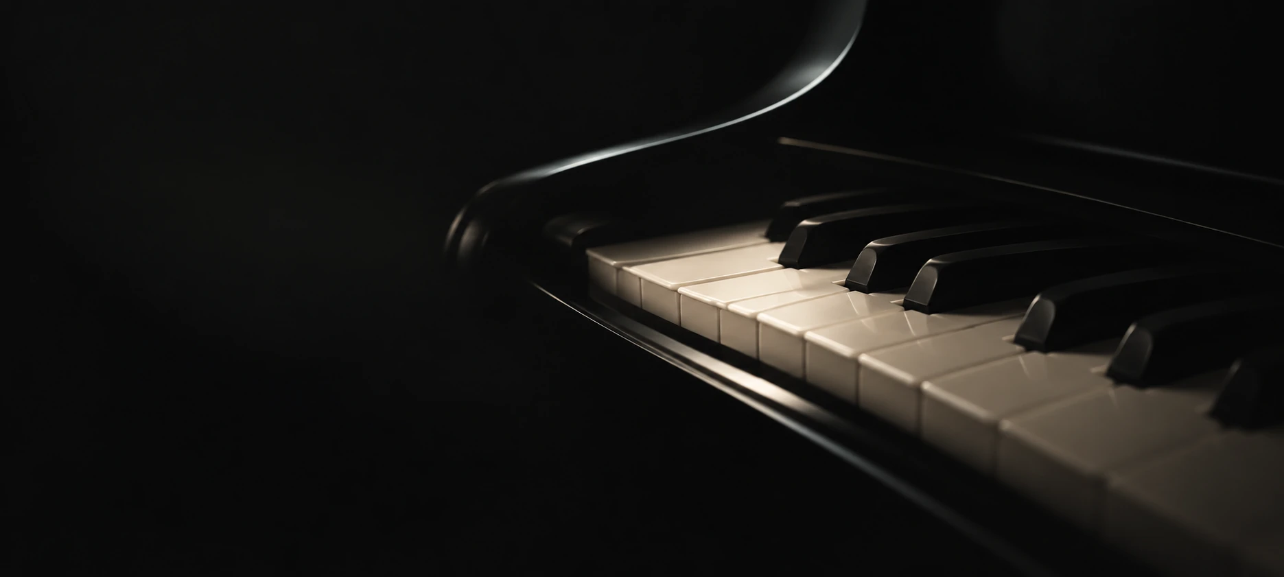 Grand piano keys and a softly lit polished edge.